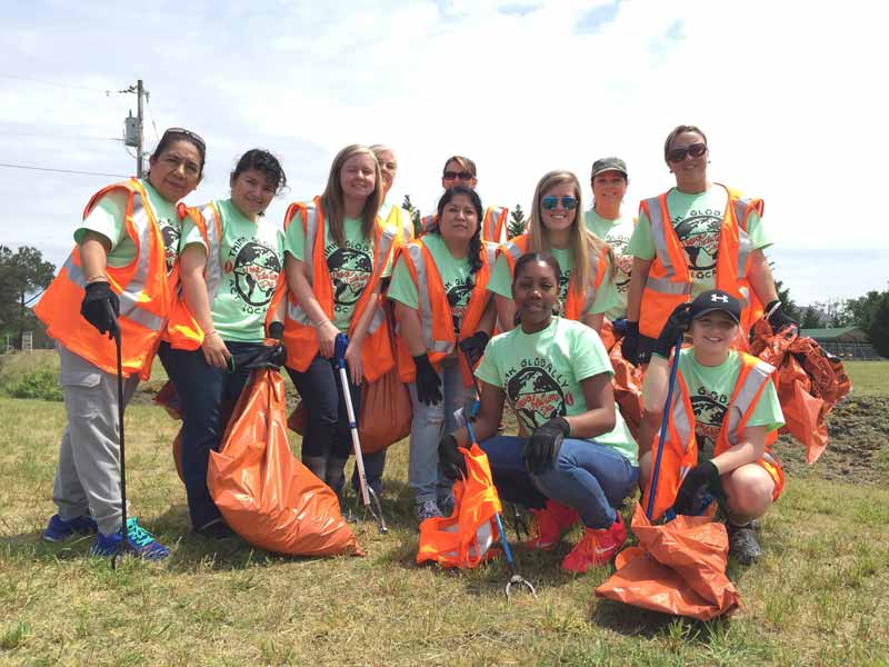 Speech Solutions therapists and students on trash pick up day